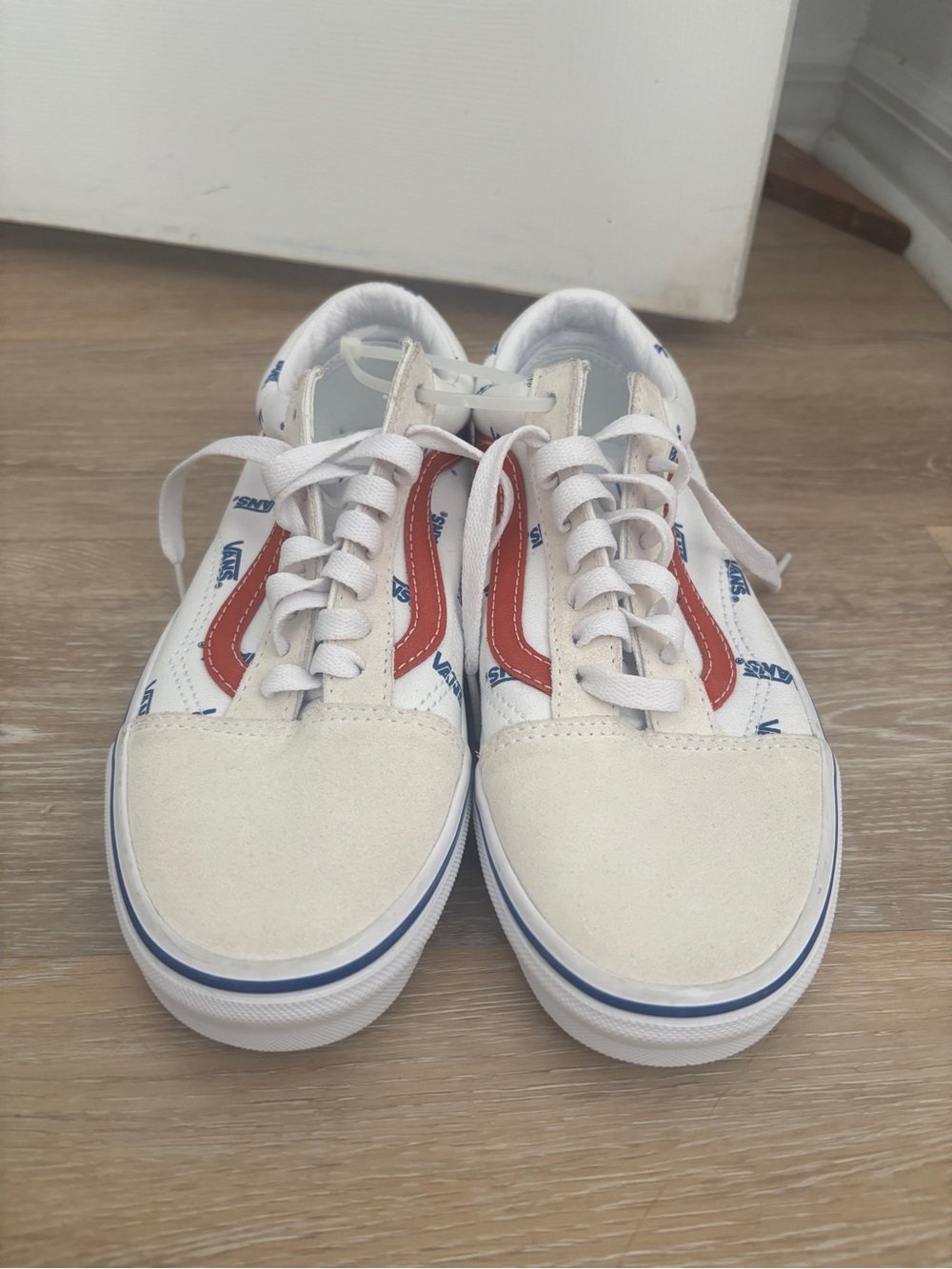 Vans White Sneakers with Red Side Stripe and Blue Logo Accents